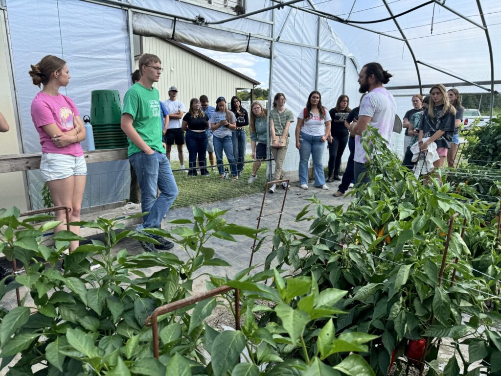 Figure 6. The HORT 318 (Field Production of Horticulture Crops) class is listening to Chris Adair (Purdue Student Farm manager) describing how we cultivate sweet peppers in a high tunnel (Photo by Petrus Langenhoven).