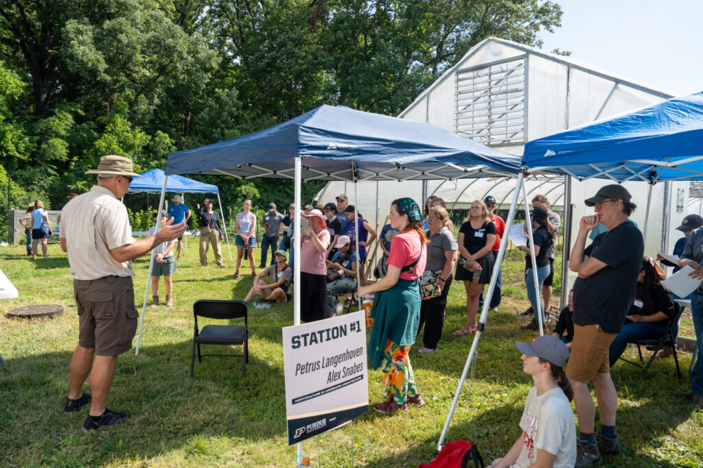Figure 9. Petrus Langenhoven is talking to attendees about pepper cultivation in high tunnels at the Small farm Education Field Day (Photo by Joshua Clark).
